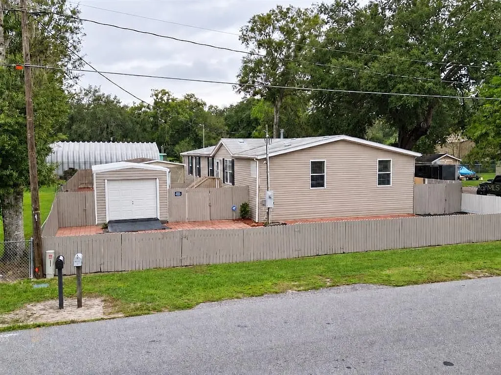 1722 Evergreen St, Kissimmee FL: front of the home on a fenced lot