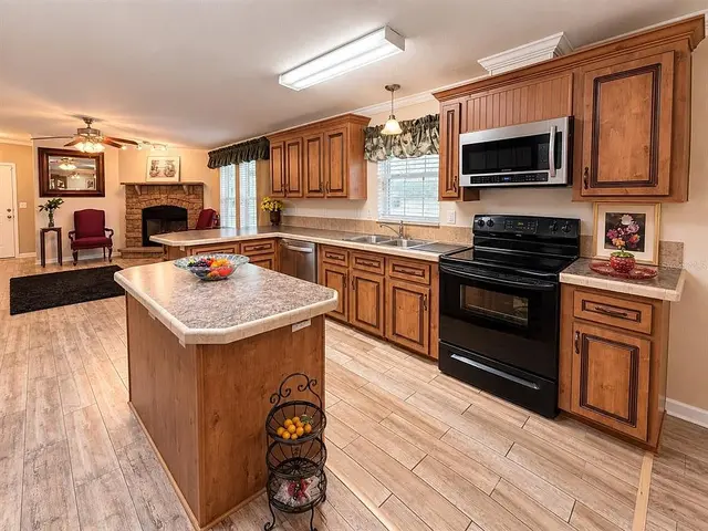 1722 Evergreen St, Kissimmee FL: kitchen with island and custom cabinetry