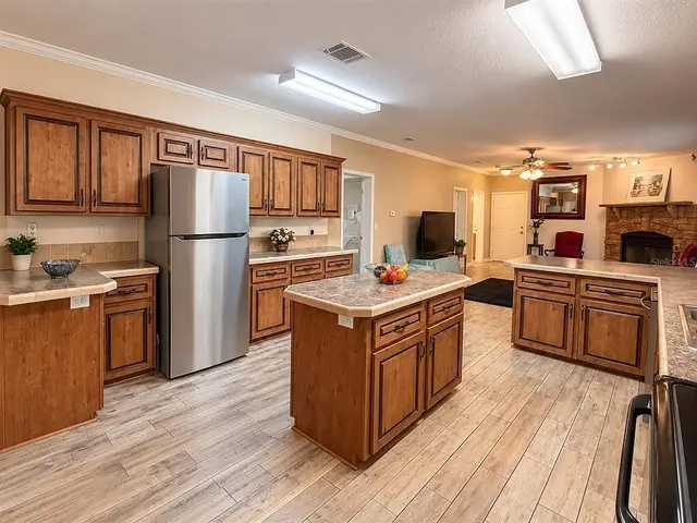 1722 Evergreen St, Kissimmee FL: kitchen with stainless steel refrigerator
