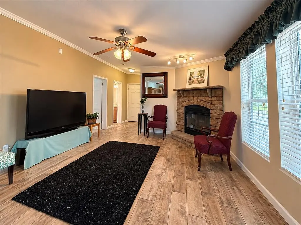 1722 Evergreen St, Kissimmee FL: family room with stone fireplace