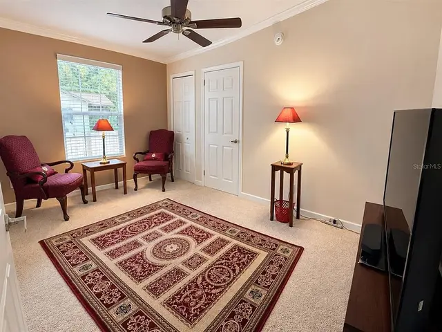 1722 Evergreen St, Kissimmee FL: bedroom with sitting area