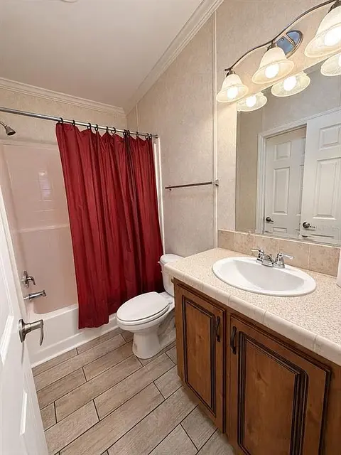 1722 Evergreen St, Kissimmee FL: bathroom with tub and shower